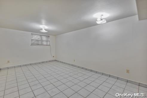 basement with light tile patterned floors