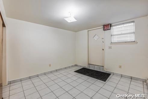 foyer with light tile patterned flooring