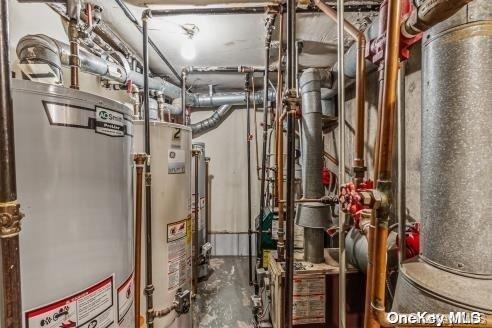 utility room featuring water heater