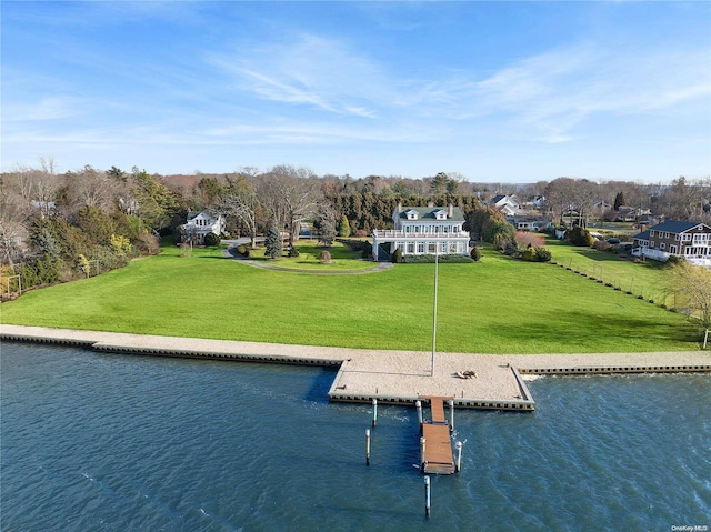 exterior space featuring a water view and a lawn