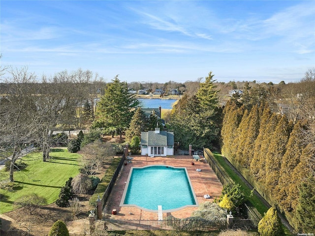 view of pool featuring a water view and a yard