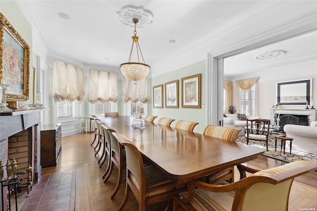 dining room with dark hardwood / wood-style floors and crown molding