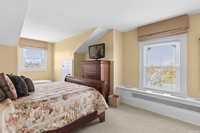 carpeted bedroom featuring radiator heating unit