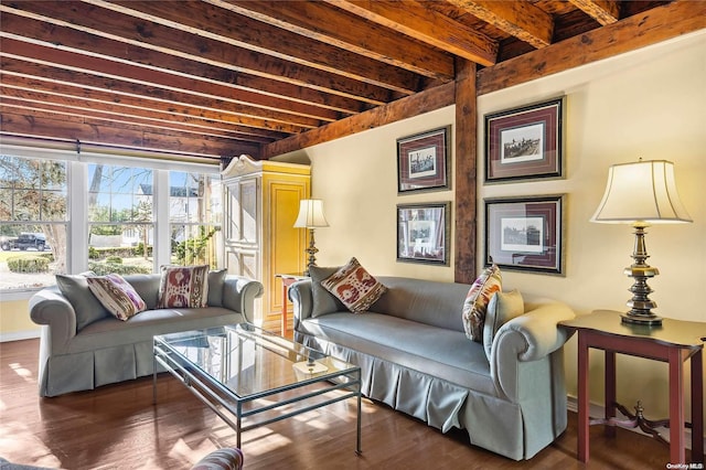 living room with beamed ceiling and dark hardwood / wood-style flooring