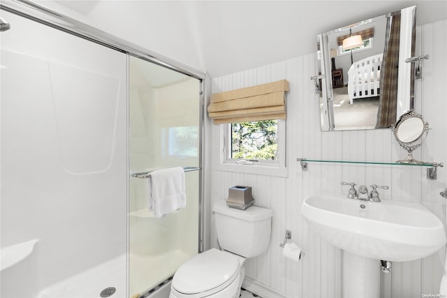 bathroom featuring an enclosed shower and toilet