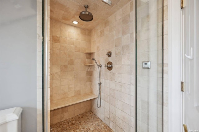 bathroom with a tile shower