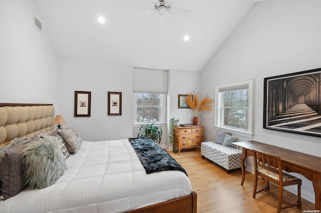 bedroom with light hardwood / wood-style floors, high vaulted ceiling, and ceiling fan