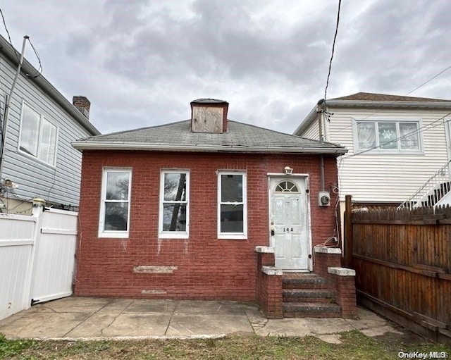 back of property featuring a patio