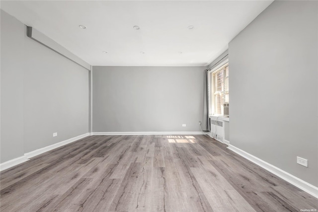 spare room with light wood-type flooring