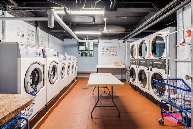 laundry area with washing machine and dryer, stacked washer / dryer, and ceiling fan