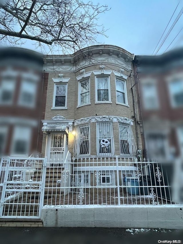 453 Ridgewood Ave, Brooklyn, NY 11208 - view of front of property featuring brick siding and a fenced front yard
