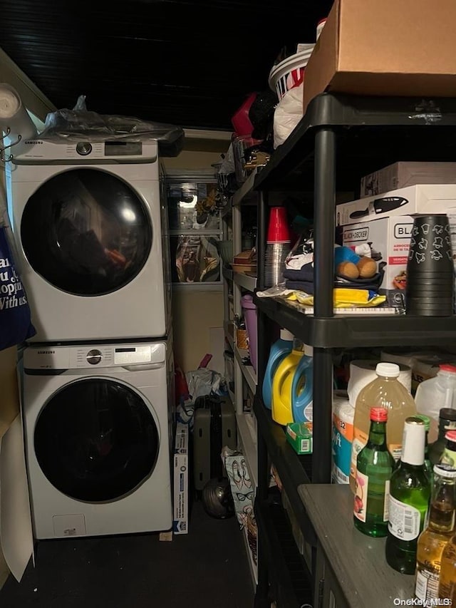 laundry room with stacked washer and dryer