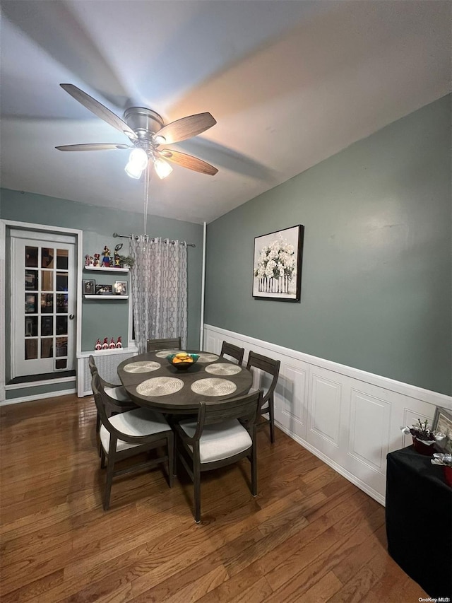 dining space with ceiling fan and dark hardwood / wood-style floors