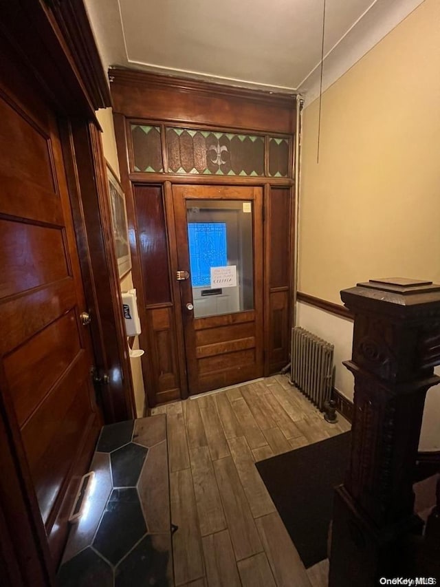 453 Ridgewood Ave, Brooklyn, NY 11208 - doorway with radiator heating unit and wood finished floors