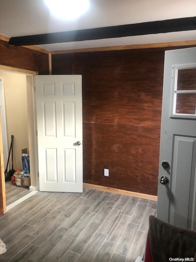 interior space featuring wood walls and wood-type flooring