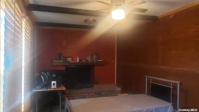 bedroom with beamed ceiling and ceiling fan