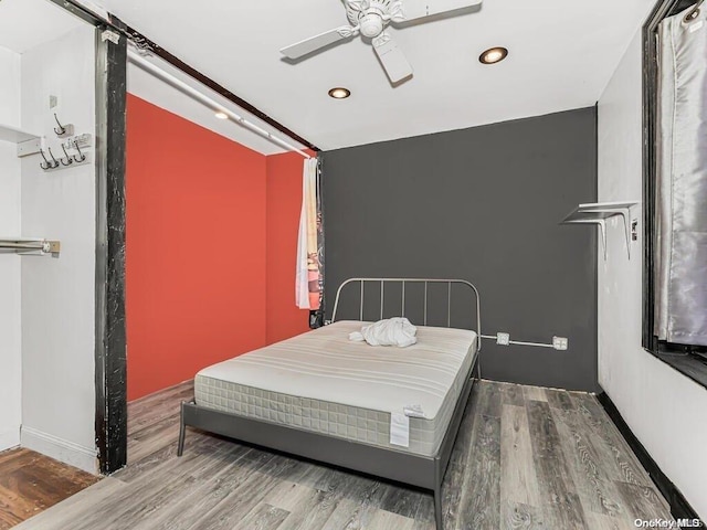 41 Convent Ave Unit 5N, New York Manhattan, NY 10027 - bedroom with wood finished floors, recessed lighting, a barn door, and a ceiling fan