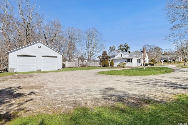 view of property exterior featuring a yard and a garage