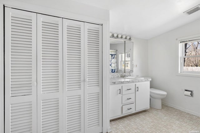 bathroom with vanity and toilet