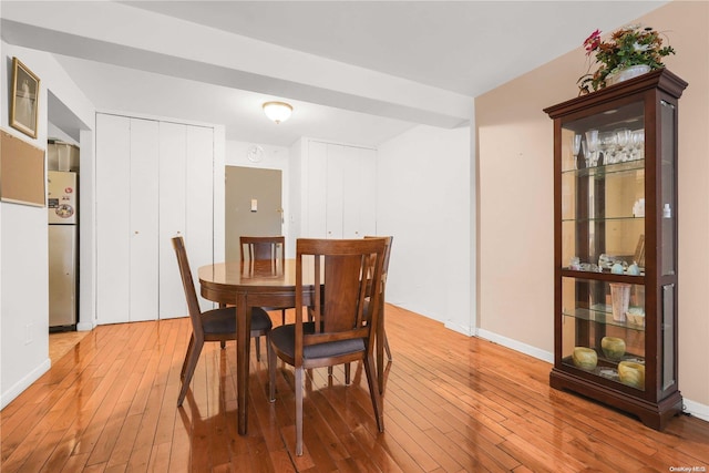 dining room with wood-type flooring