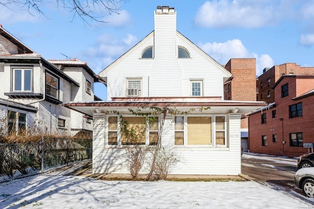 view of snow covered house