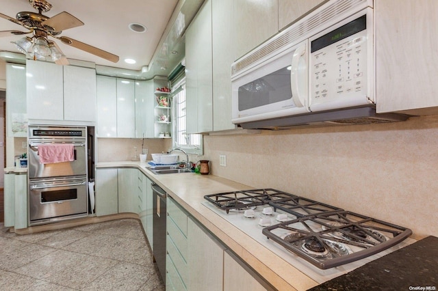 kitchen with ceiling fan, sink, and appliances with stainless steel finishes