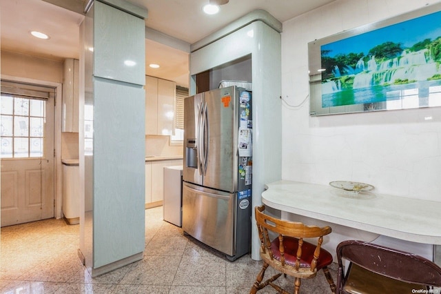 kitchen with stainless steel refrigerator with ice dispenser