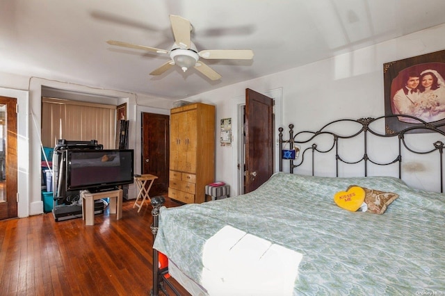 bedroom with ceiling fan and dark wood-type flooring