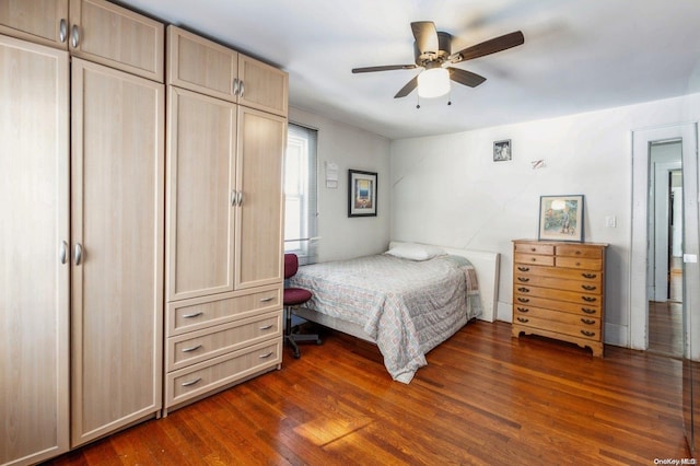 bedroom featuring ceiling fan and dark wood-type flooring