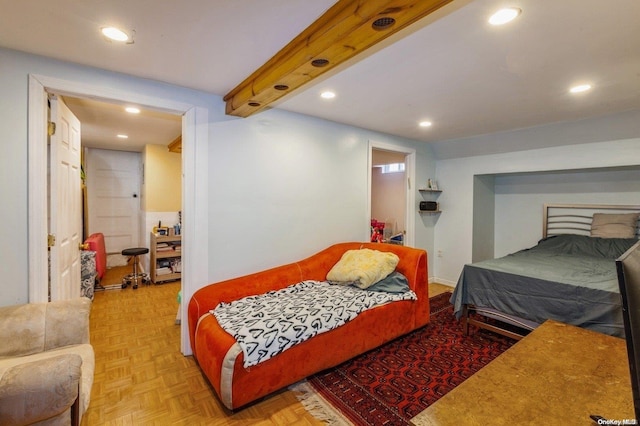 bedroom with beam ceiling and light parquet floors