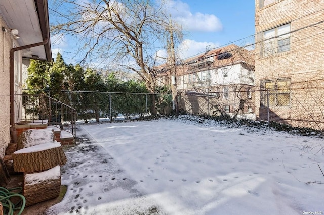 view of yard covered in snow