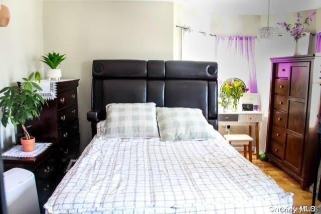 bedroom with light hardwood / wood-style floors