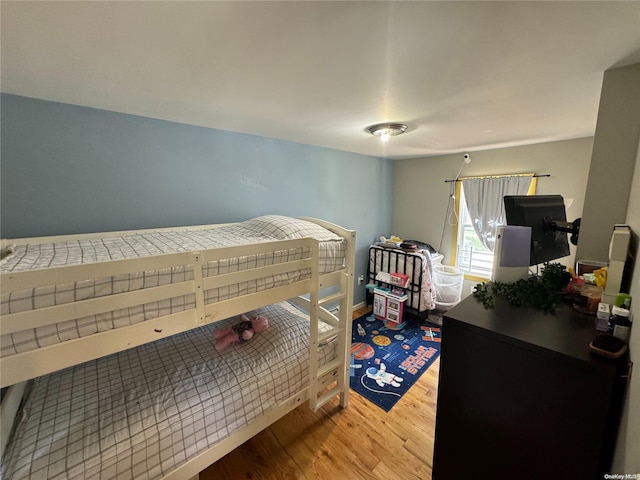 bedroom with hardwood / wood-style floors