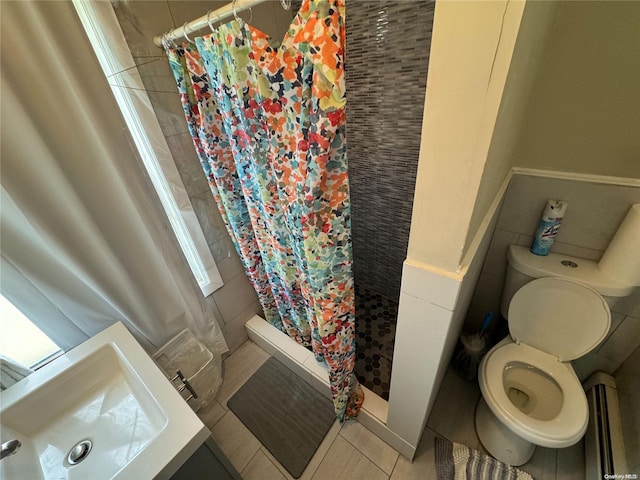 bathroom with a shower with shower curtain, tile patterned flooring, toilet, and baseboard heating