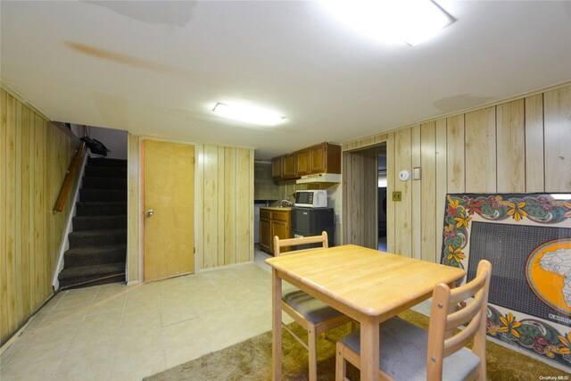 dining area with wooden walls