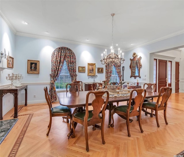 dining space with a chandelier, ornamental molding, and light parquet floors