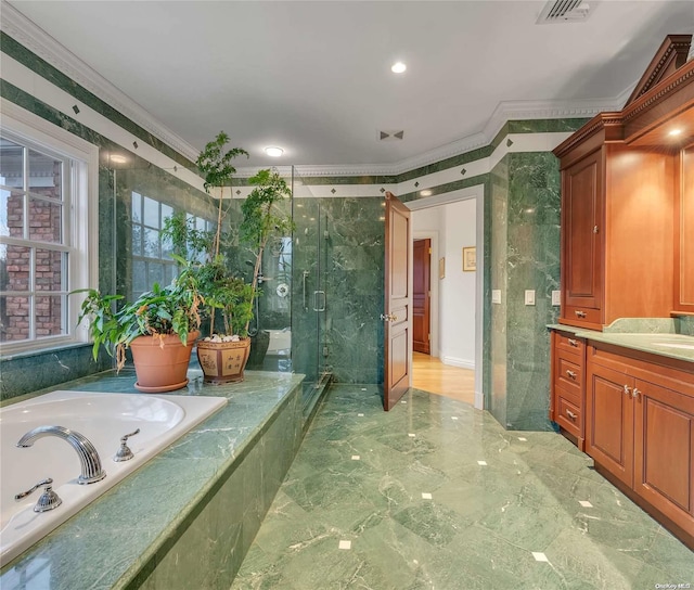 bathroom featuring vanity, ornamental molding, and plus walk in shower