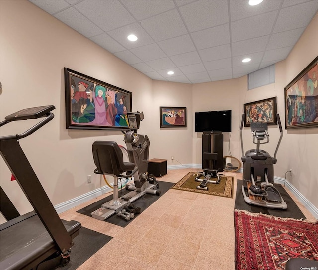 workout room with a paneled ceiling