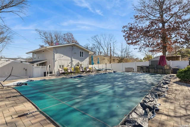 view of swimming pool featuring a patio area