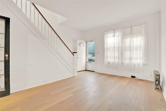 foyer with light hardwood / wood-style floors