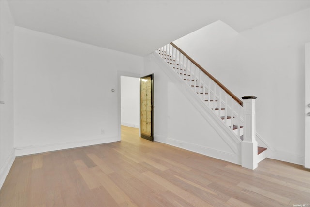 unfurnished living room with light hardwood / wood-style flooring