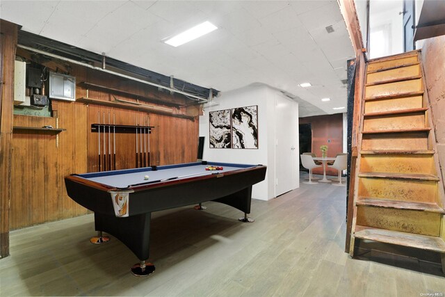 rec room featuring wood walls, billiards, and light wood-type flooring