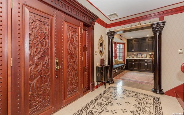 hall with ornamental molding and ornate columns