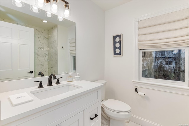 bathroom with tile patterned floors, vanity, and toilet