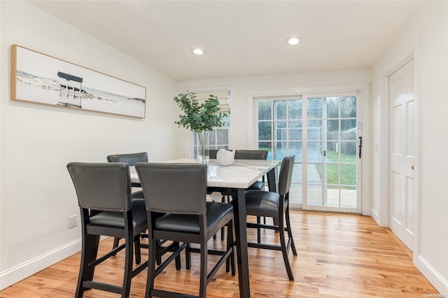 dining space featuring light wood-type flooring