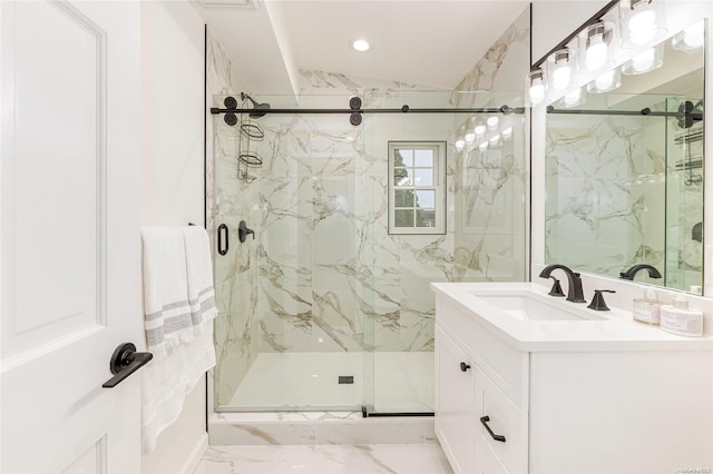 bathroom featuring vanity and a shower with shower door