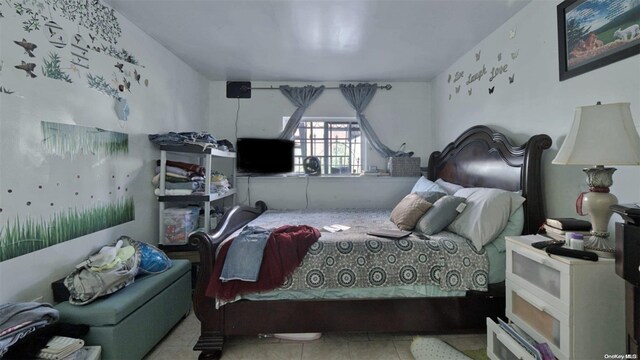 bedroom with light tile patterned floors