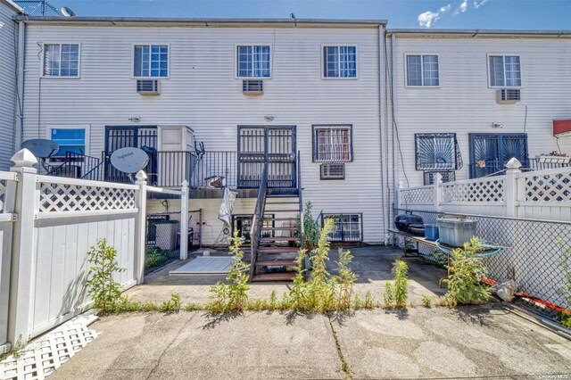 back of house featuring a wooden deck