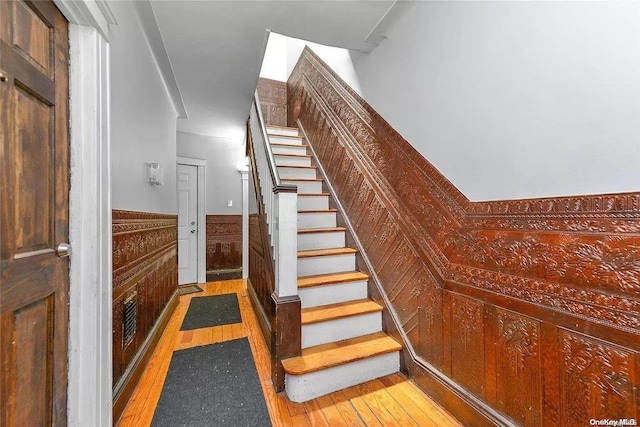 stairs featuring wood-type flooring