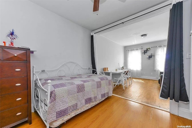 bedroom featuring ceiling fan and light hardwood / wood-style floors